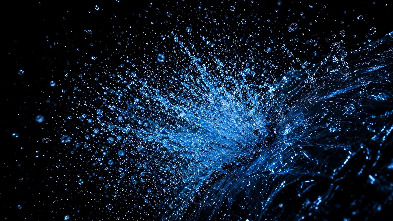 High-pressure water jet striking a black bin